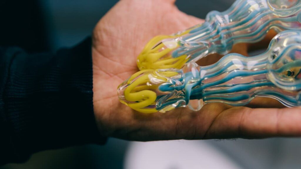 hand holding two bud bowls
